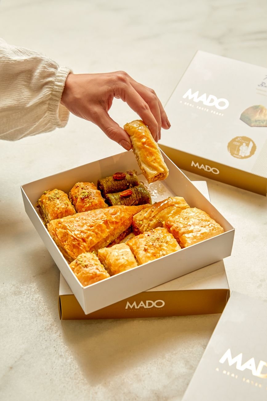 Assorted pastries arranged in a gift box, showcasing a selection of artisan sweets