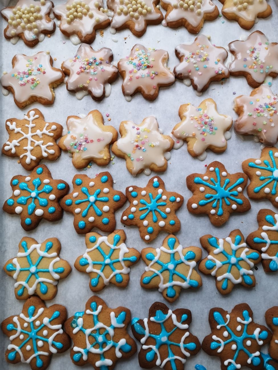 Colorful iced sugar cookies in festive snowflake and seasonal designs